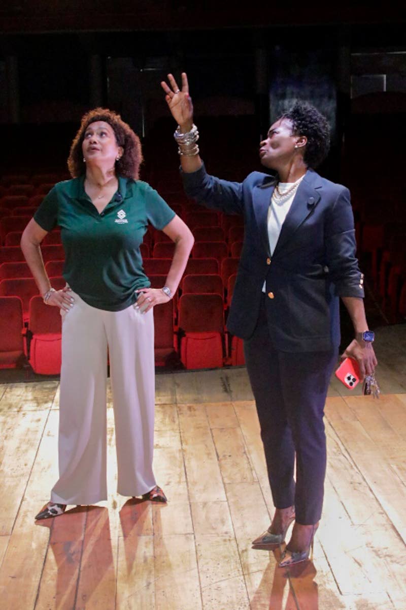 Supreme Ventures Foundation Director Heather Goldson (left) looks on as Executive Director of the Little Theatre Marisa Benain points out details of the venue’s ongoing renovation project. 