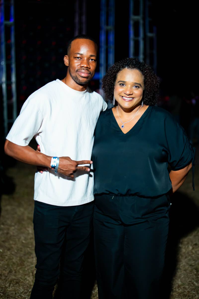 Guinness Junior Brand Manager Lasana Wilson (left) and Brand Manager Nadine Hylton enjoy the action at Dream Live, where Guinness served as the official performance sponsor.