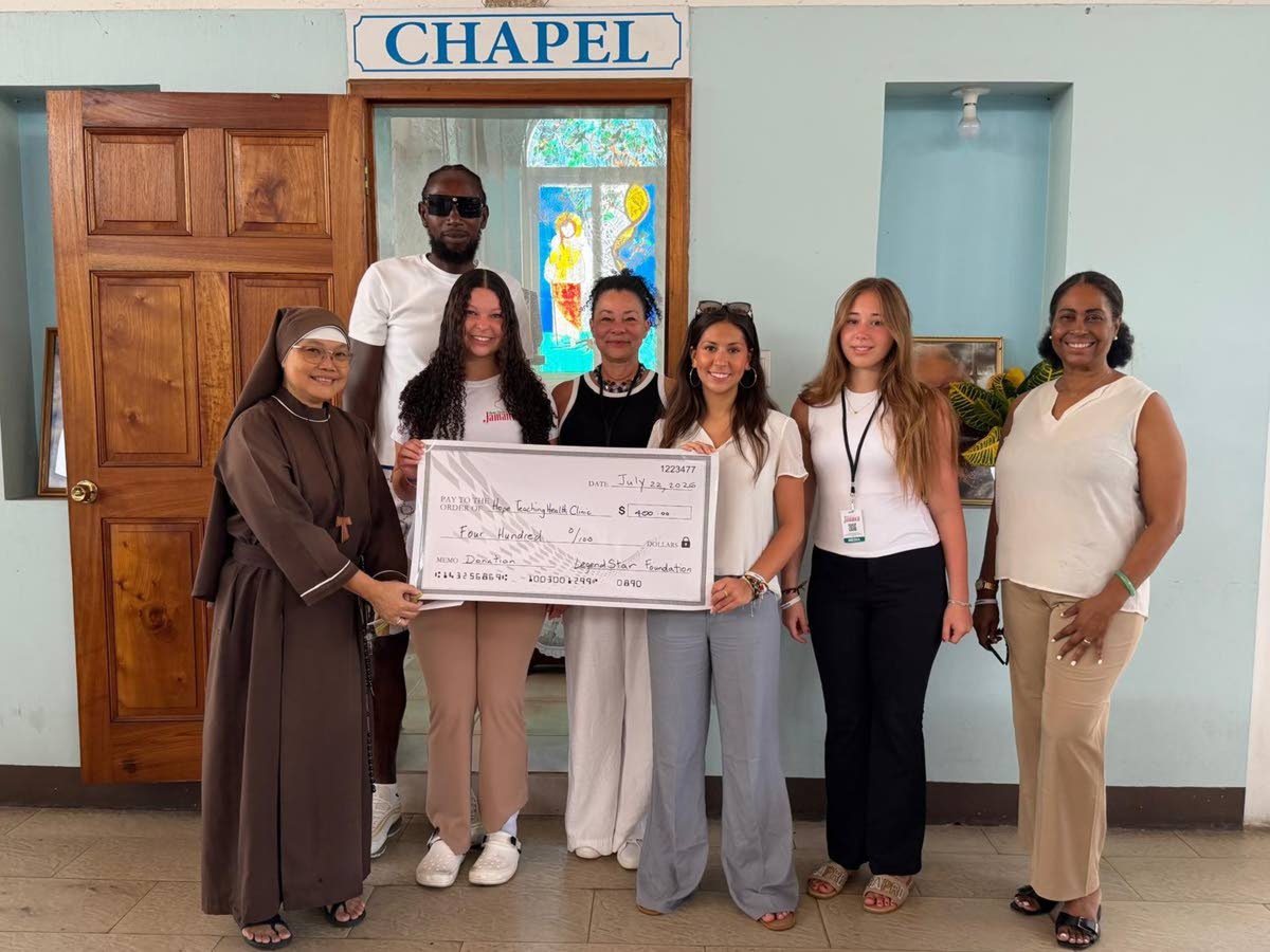Donation of funds to the Hope Teaching Clinic from Legend Star Foundation. From left are Mother Joy, Chris Brown, Rhea Adams, Gina Tulloch Adams, Adriana Taylor, Chloe Humbles, and Martena Weatherly of Good Shepherd Foundation. 