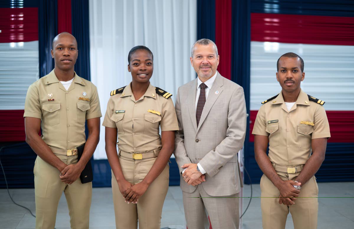 On his visit to Caribbean Maritime University, Arsenio Dominguez (second right) Secretary General of the International Maritime Organization with (left to right) Paulos Mckenzie, Year Two Engine Cadet,  Nyshauna Strachan, Second Officer and Andre Gordon, T