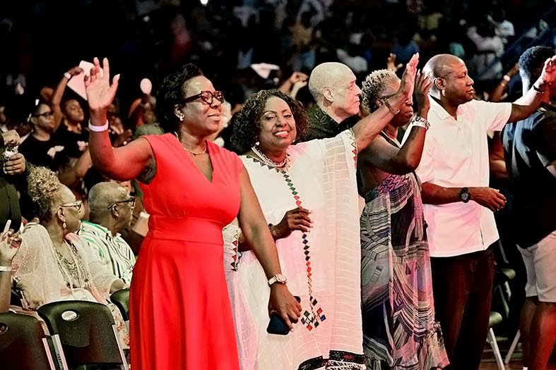 Olivia Grange (second left) and Novlette Howell (left), director of the CHASE Fund dancing at the JCDC Jamaica Gospel Star 2026 final at the National Indoor Sports in St Andrew on Sunday.