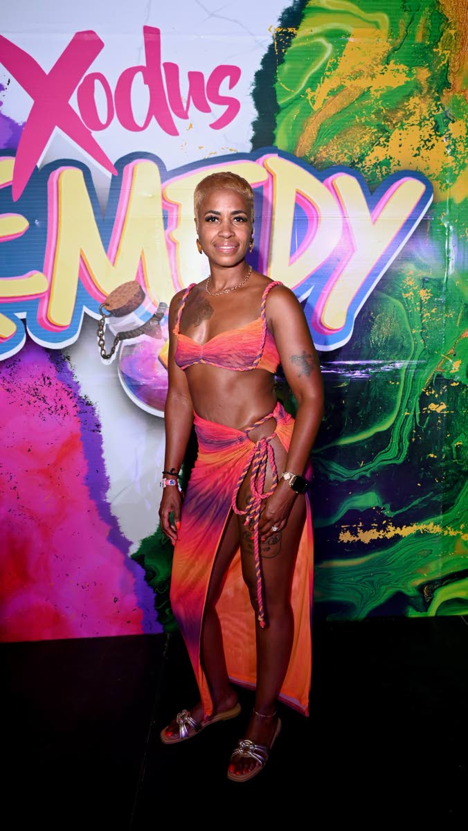 Monica Jackson, from Virginia, struck a pose in a vibrant orange ombré bra top paired with a matching side-tie maxi skirt.