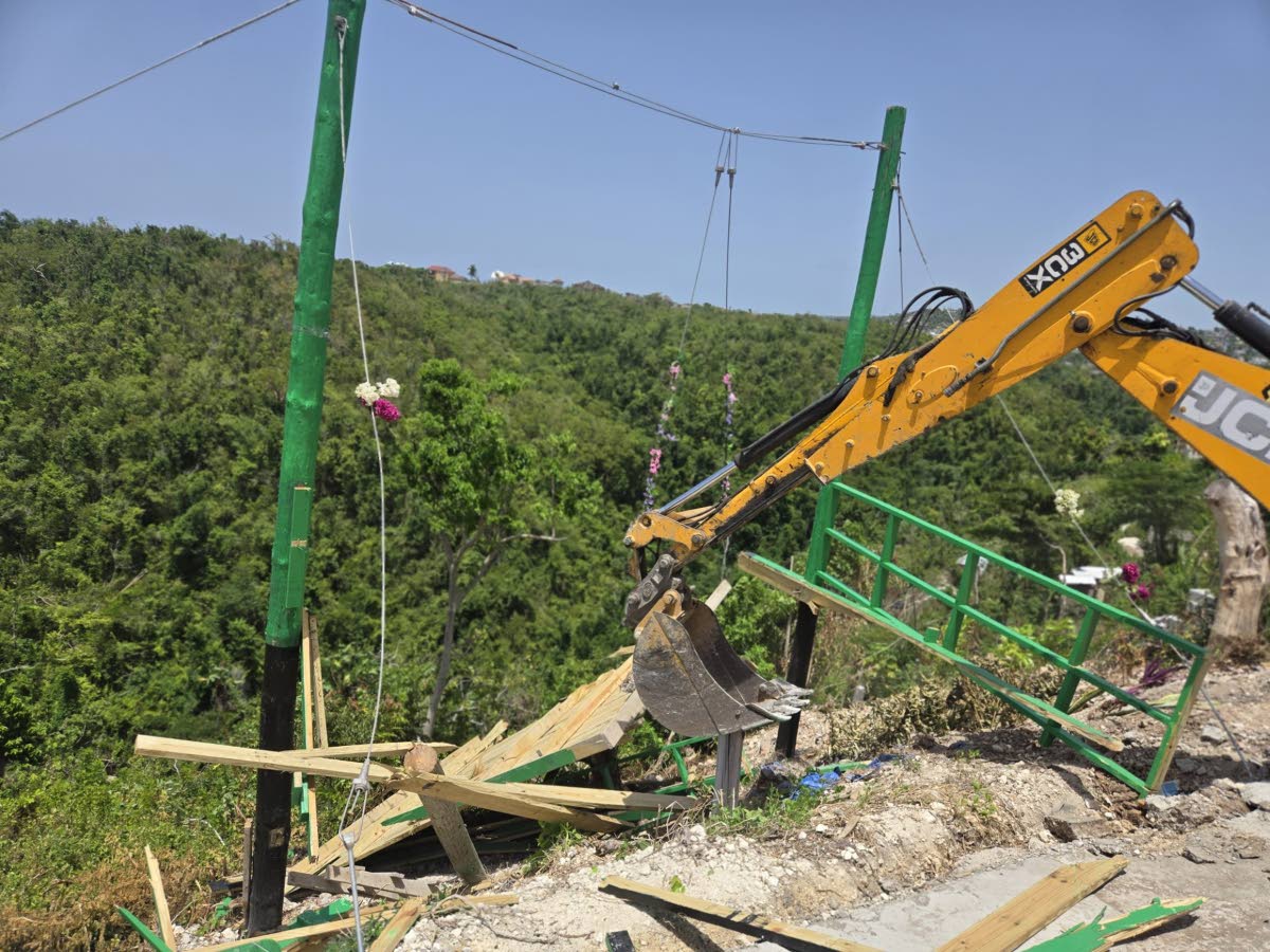 The unlicensed swing attraction in St James being demolished yesterday. 
