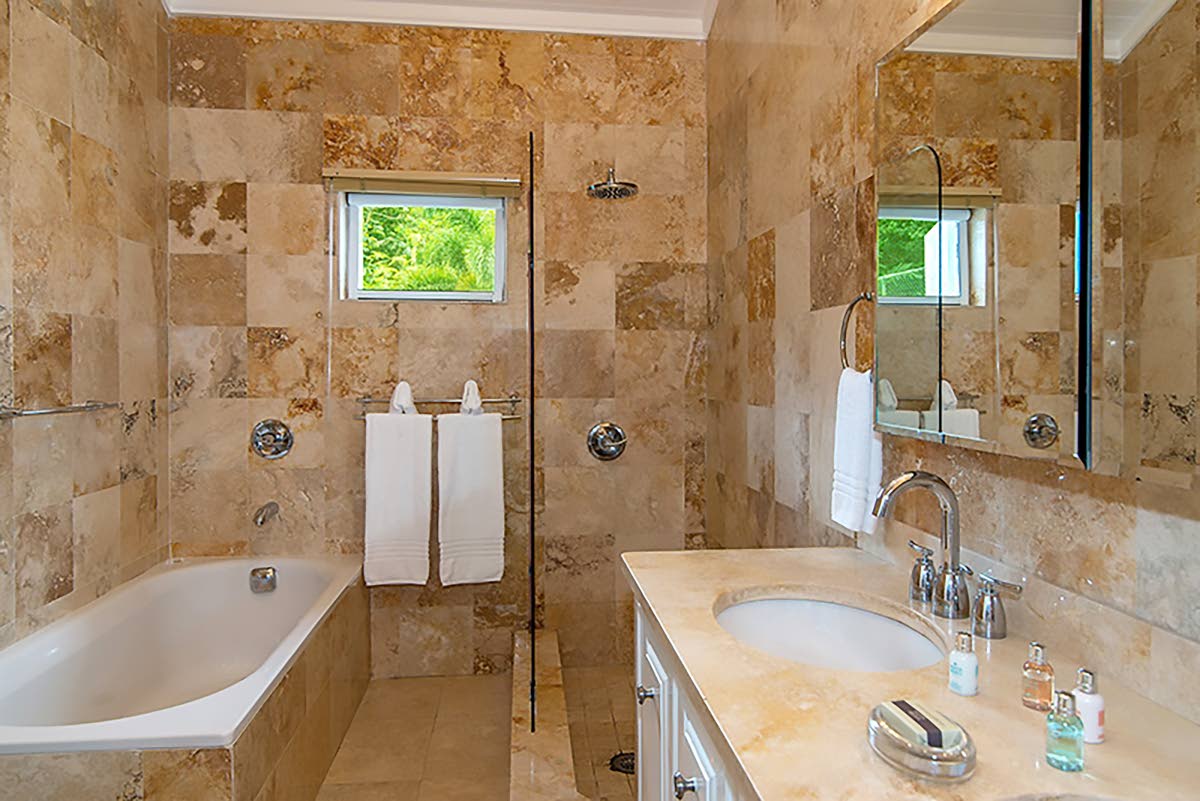 All bathrooms from floor to ceiling are luxuriously clad in marble.