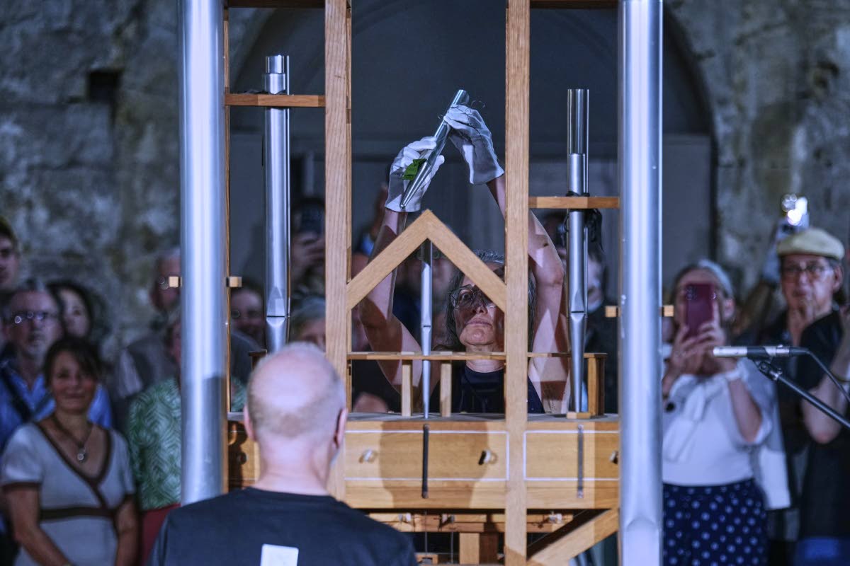 Anneli Borgmann, chairwoman of the John Cage Organ Project, adds a pipe during a chord change on the organ inside the medieval Burchardi Church in Halberstadt, Germany, on Wednesday. 
