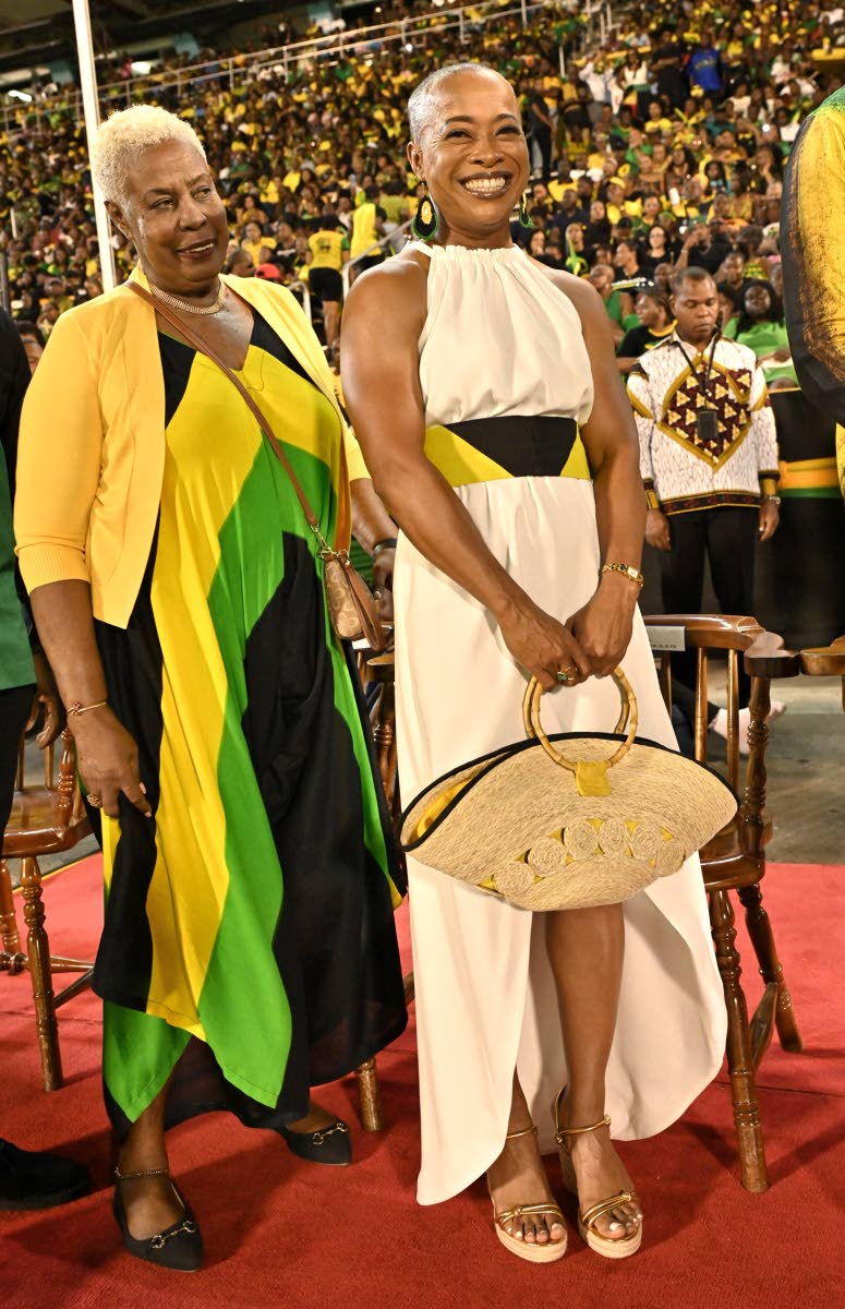 The always stylish Vice Admiral Antonette Wemyss Gorman (right), chief of defence staff of the Jamaica Defence Force, pairs a high-low halter with a raffia top-handle bag. She was photographed with Lorraine Dobson, deputy mayor of Kingston, who showcases h