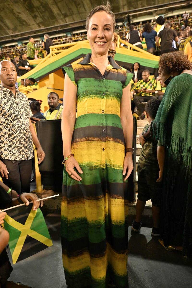 Senator Kamina Johnson Smith, minister of foreign affairs and foreign trade, dons a horizontally striped tie-dye maxi dress in the colours of the Jamaican flag. 