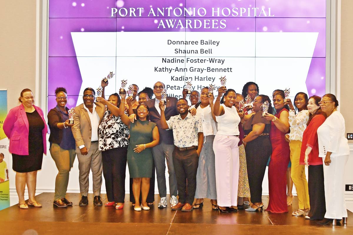  Port Antonio Hospital awardees, with Health Minister Dr Christopher Tufton (centre), Regional Director Fabia Lamm (left) and Board Chairman Laura Heron (second left).