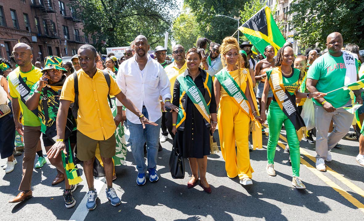 Acting Jamaica Consulate General in NY Ariel Bowen (fourth from right) and singer Nadine Sutherland (third right) lead the parade.
