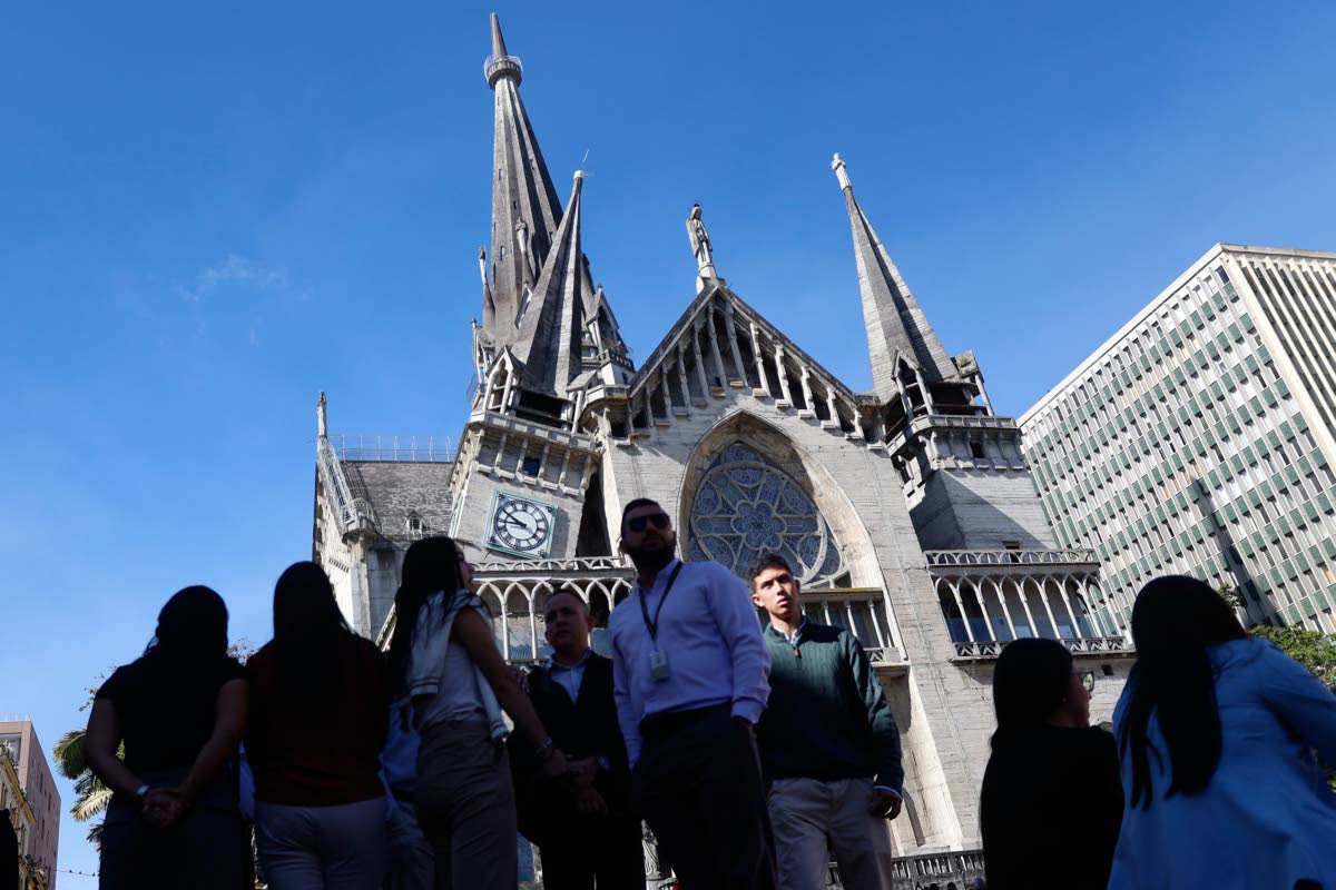 Residents stand outside the Cathedral of Manizales after it was damaged by an earthquake in Manizales, Colombia, Monday.
