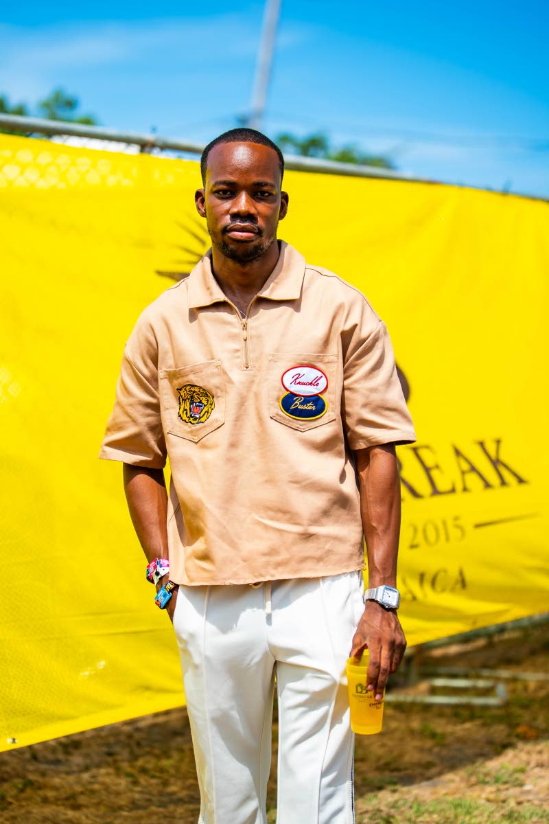 Johnnie Walker Junior Brand Manager Lasana Wilson skips the cowboy look, keeping his Western-inspired 'fit contemporary in a tan utility shirt and white trousers.