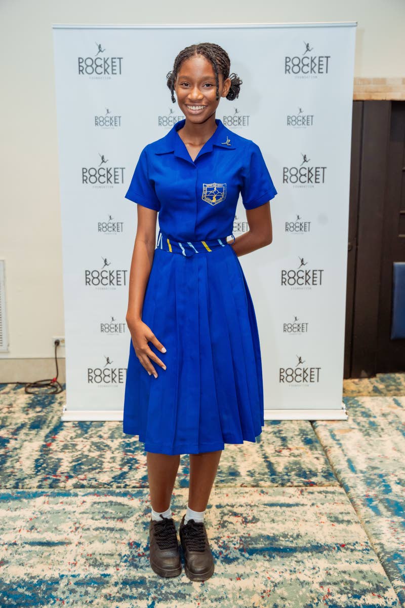 right: Lysandra Taylor flashes a smile at the Pocket Rocket Foundation’s 2023 Scholarship Awards Ceremony. In July this year, she graduated as valedictorian of Papine High School in St Andrew.