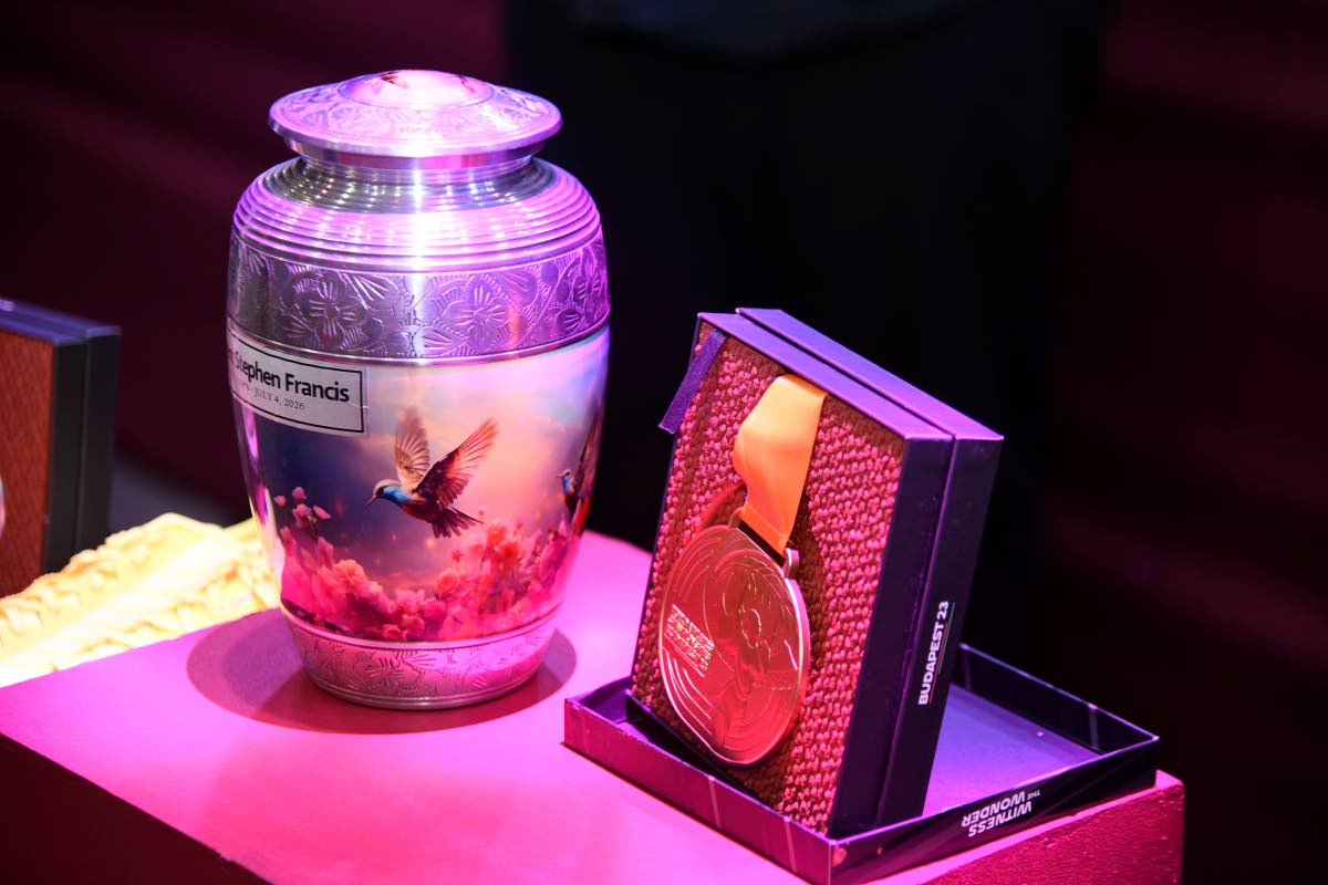 The urn that holds the ashes of the late Stephen Francis sits on a pedestal at the National Indoor Sports Centre during his Service of Thanksgiving yesterday. 