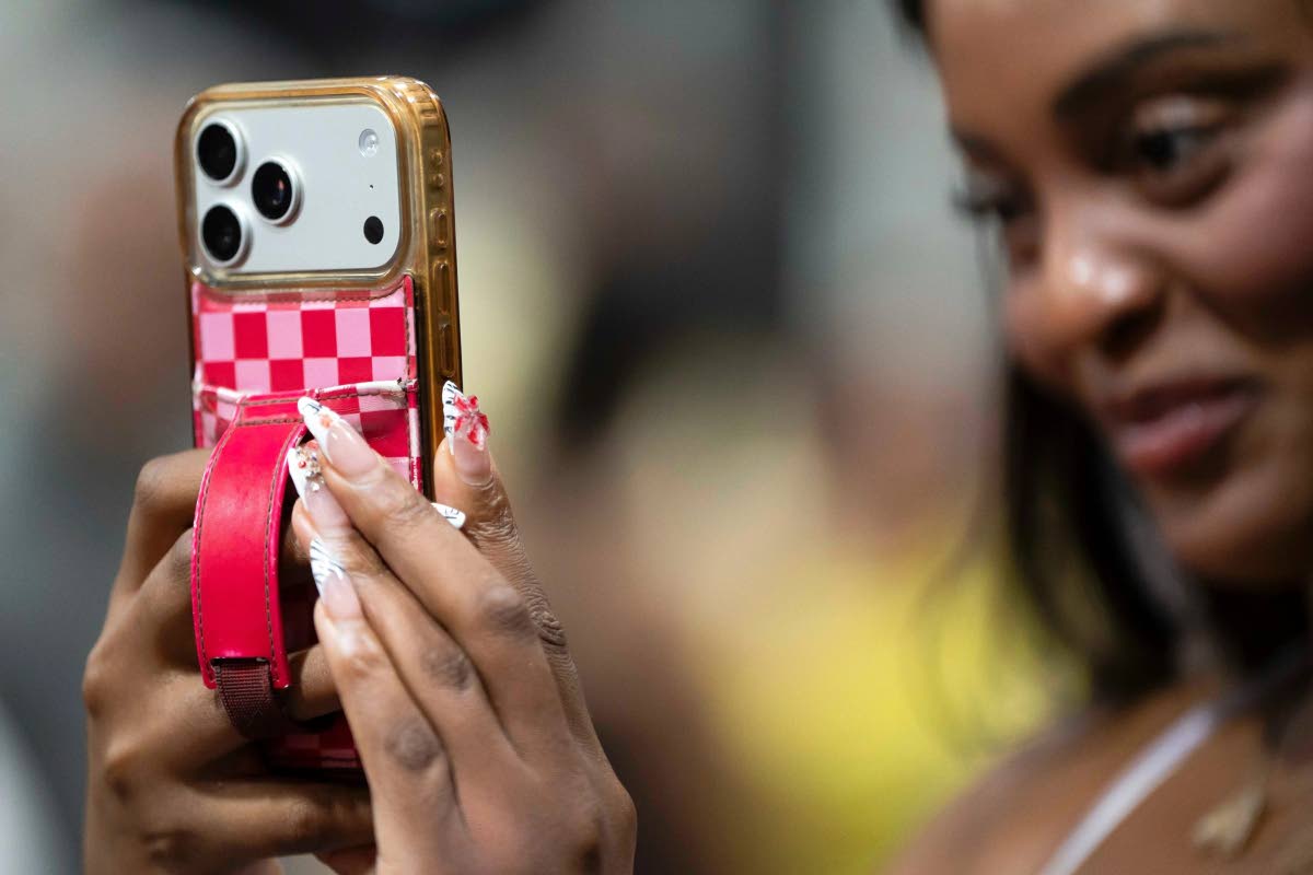 Content creator Aiesha Beasley films during the grand opening of Padeland. 