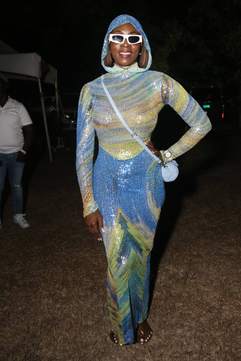 Tasha Manley rocks a sequined hooded maxi number.