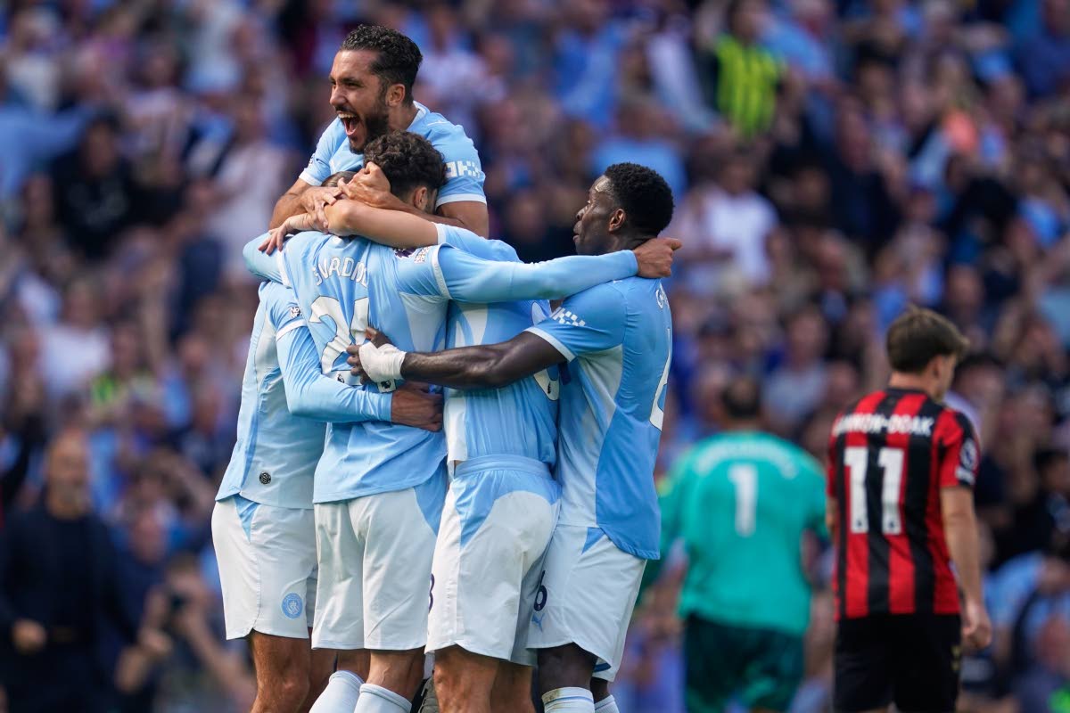 Manchester City's Josko Gvardiol (24) celebrates with teammates after scoring his side's second goal during the English Premier League soccer match between Manchester City and Bournemouth in Manchester, England, Sunday, Aug. 23, 2026. (AP Photo/Dave Thomps