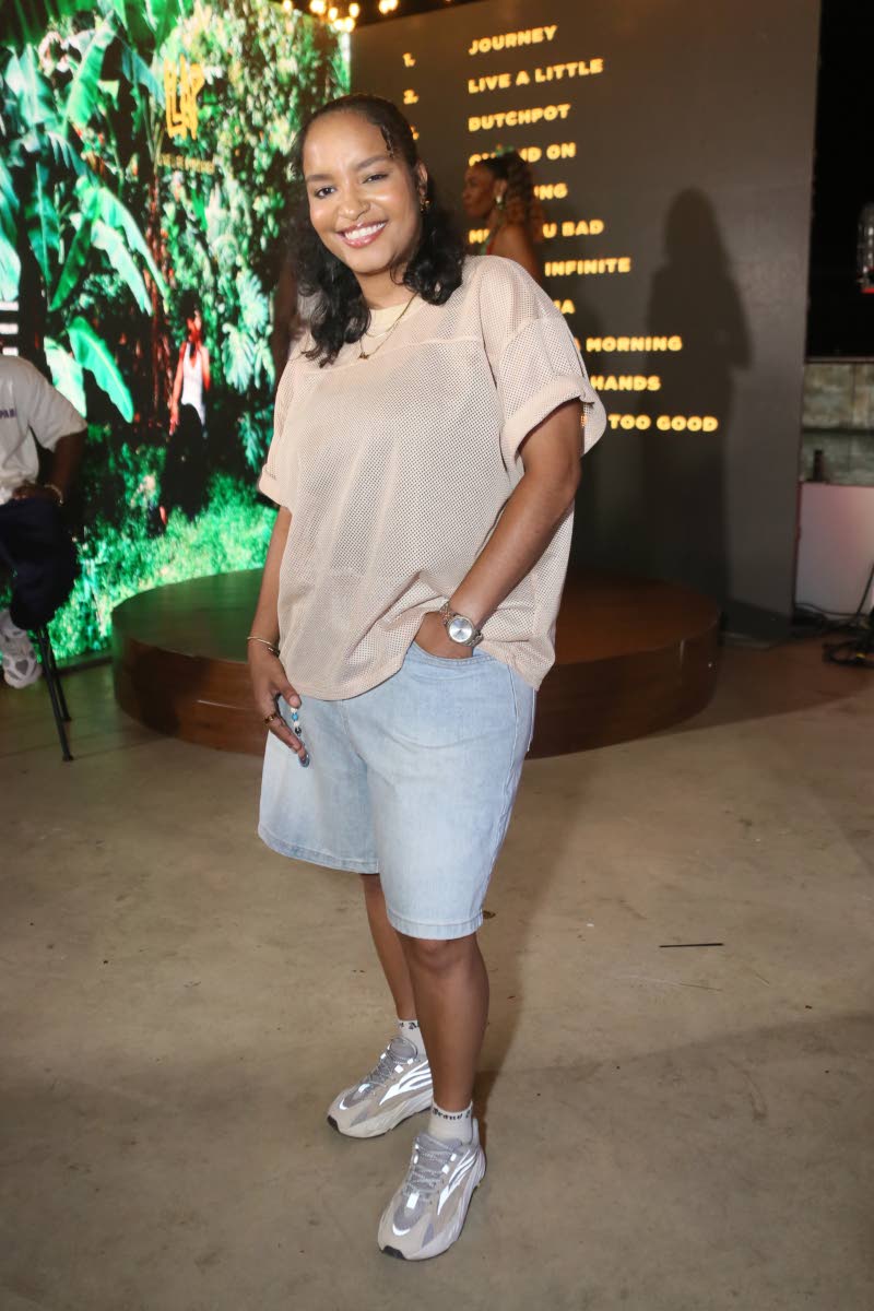 DJ Nova keeps it laid-back in a crew-neck T-shirt, jorts and beige-and-silver trainers.