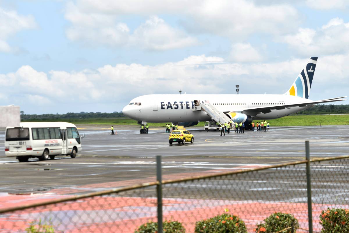Plane carrying the deportees from the US arrives at the Roberts International Airport outside of Monrovia, Liberia, Thursday, Aug. 20, 2026. (AP Photo/Alexander Wiaplah)