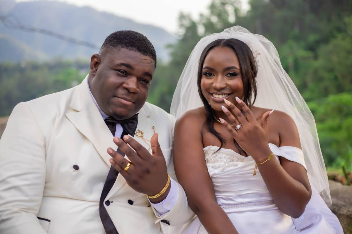 Mr and Mrs Johnson show off their wedding bands.