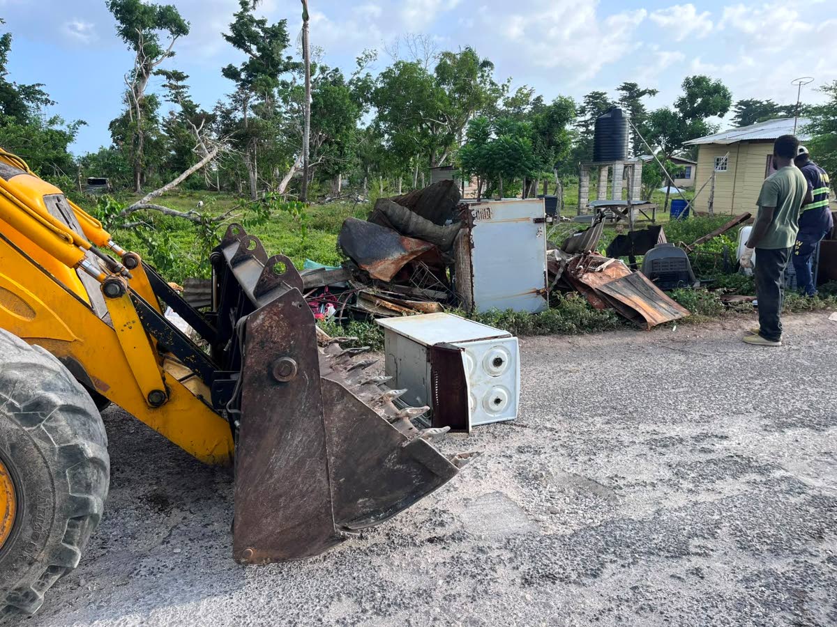 Bulky waste, including old appliances and other discarded household items, along Strathbogie Lane as residents work to clear the area.