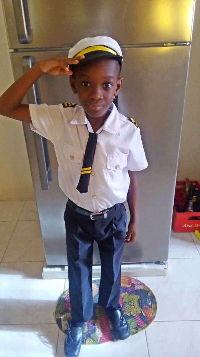 A younger Mikhail Grey (while at prep school) in a pilot’s uniform.