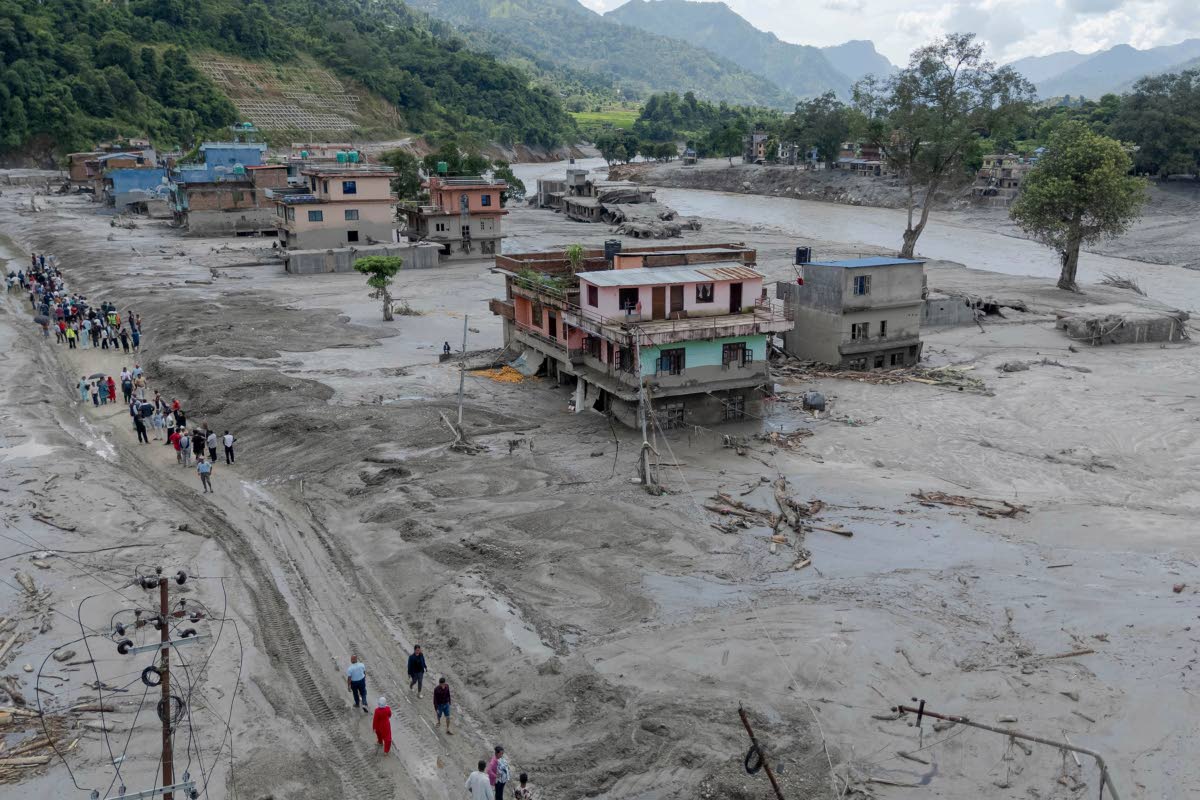 
In this photo released by Xinhua News Agency, a drone photo shows a flood-hit area in Nuwakot, Nepal on Thursday, August 27, 2026.