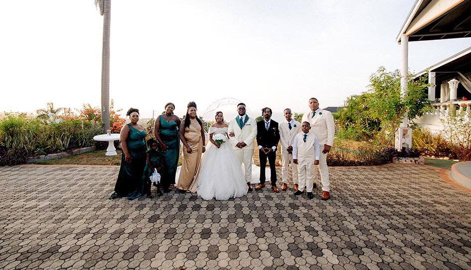 The Hoffsteads (centre) are joined by their wedding party. Pictured (from left) are Ruschelle Hoffstead, Damoya Wilson, flower girl; Shaniqua Llewellyn, Sashanya Llewellyn, Stafford Hoffstead, Edwin Graham, Jemmey Hines, and Rick-Jay Llewellyn.