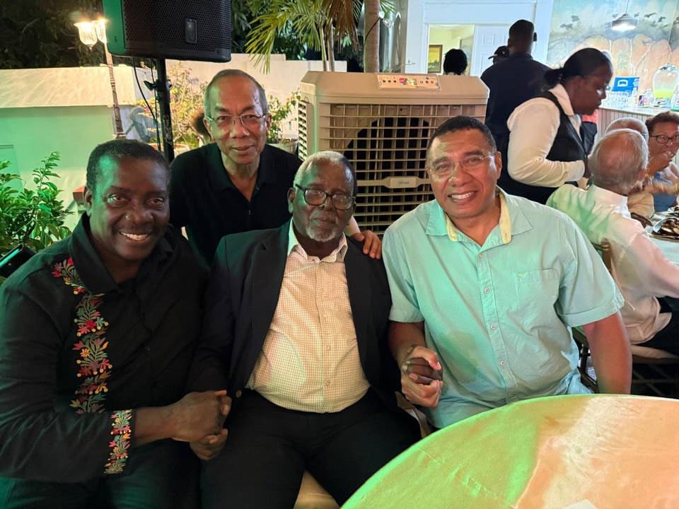 Pearnel Charles Sr (third left) is congratulated by (from left) Jamaica Labour Party (JLP) Chairman Robert Montague, JLP General Secretary Dr Horace Chang and JLP Leader Dr Andrew Holness.