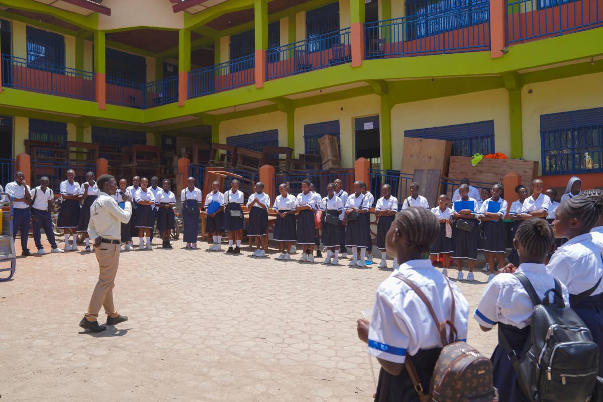 Students attend a school assembly on the first day of the new school year amid the Ebola virus outbreak, in Ituri, Congo, Tuesday, Sept. 1, 2026. (AP Photo/Dieudonne Dirole)