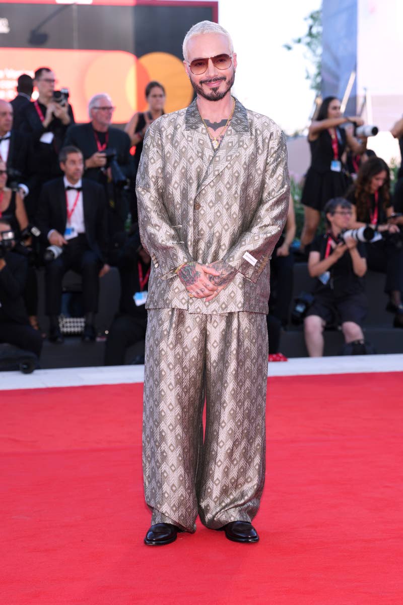 J Balvin gives traditional tailoring a major update in Emporio Armani. The oversized double-breasted jacket and ultra-wide trousers brought plenty of personality to the patterned suit.