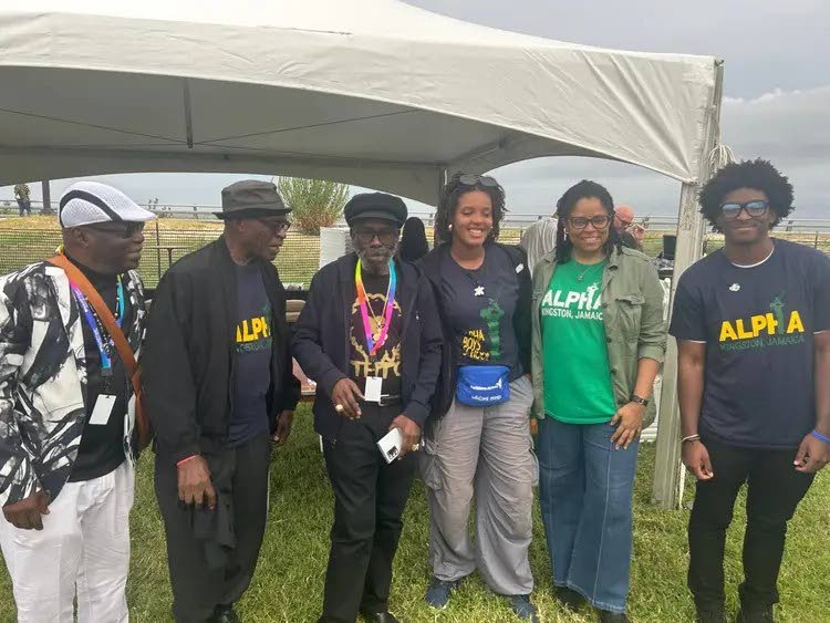 Past student of  Alpha Boys School  Johnny Osbourne, centre, shares a light moment   with Alpha School of Music students (from left) Josh-Lemar Palmer, Alpha Director of music Gay Magnus, Zuri Gordon, Sparrow at last year’s Supernova International Ska Fe