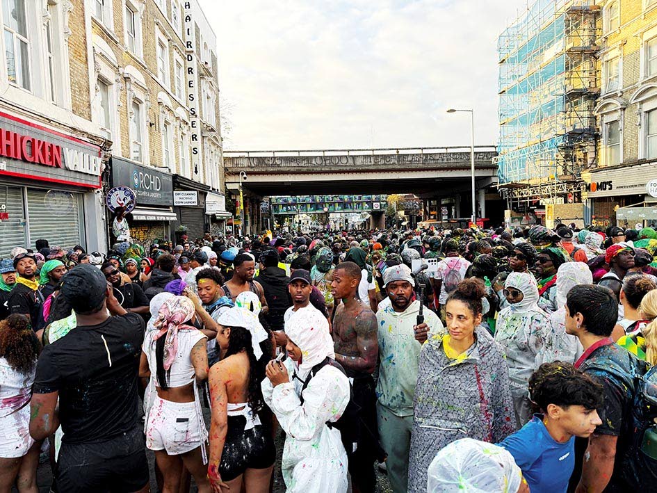 Crowds gather early Sunday morning in Notting Hill, London, for the start of J’ouvert 2026. 