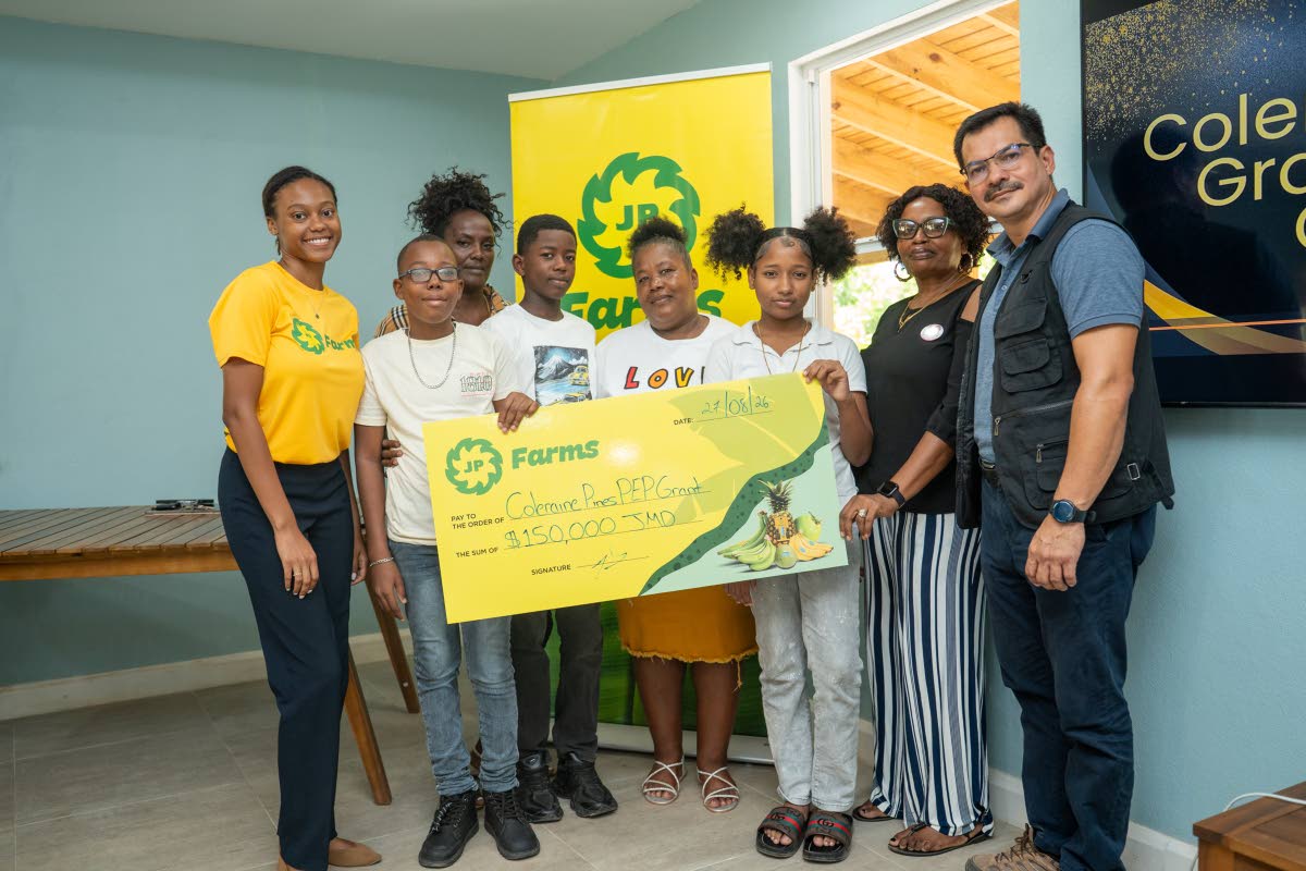 Mario Figueroa (right), general manager of JP Farms, and Ariel Wedderburn (left), marketing coordinator, pose with recipients and parents at the inaugural Coleraine Pines PEP Grant presentation. Also pictured from left are Deshawn Davis, Tanya Eastwood, Du