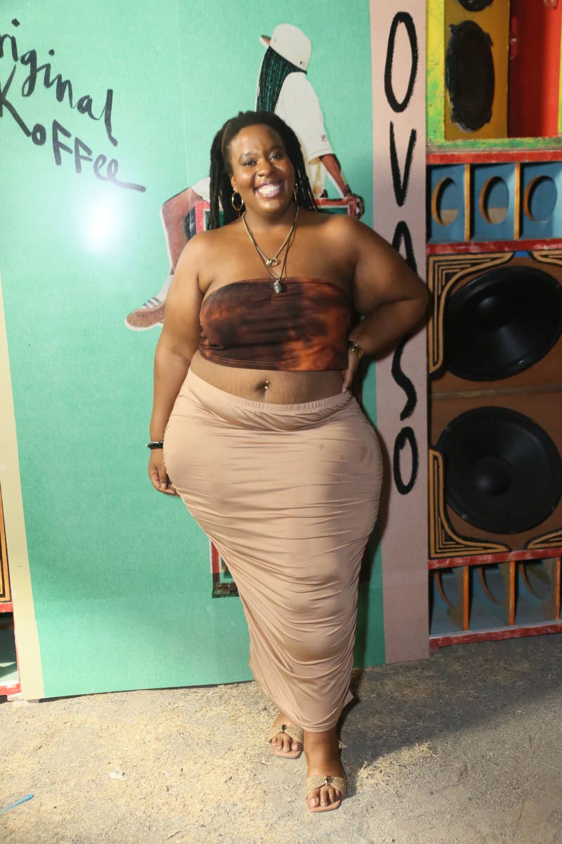 Vocalist Courtni Jackson hits the right style note in earthy tones and a vibrant smile.