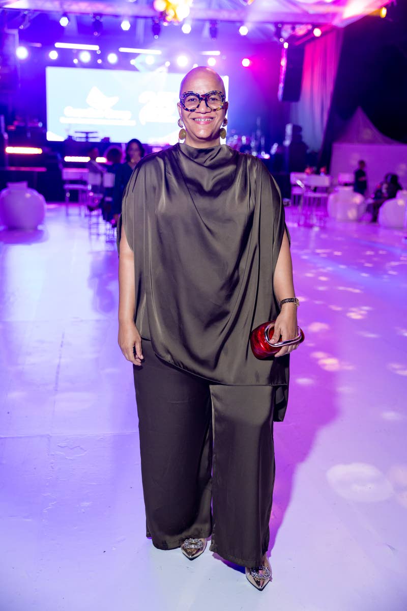 Nakeisha Bell, Guardian General Insurance Jamaica client solutions associate, is perfectly polished in a black co-ord featuring a draped batwing-sleeve blouse and matching straight-leg pants.