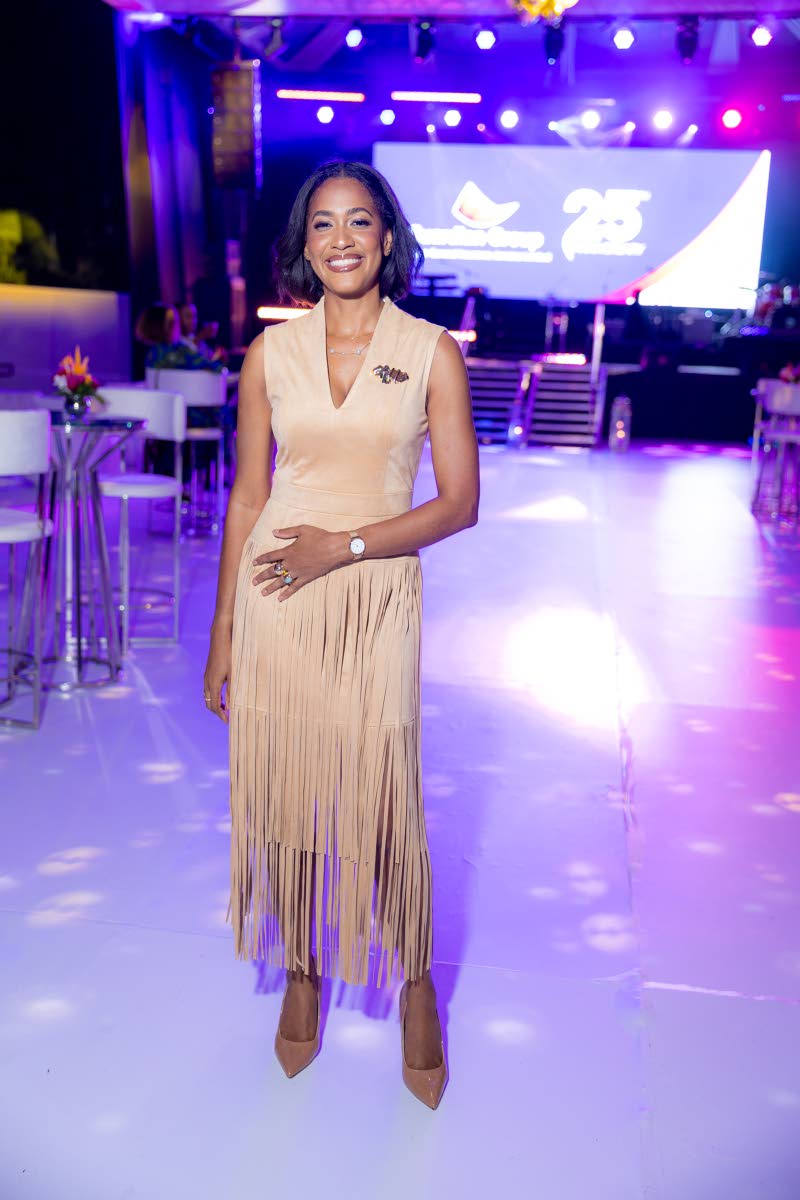 Camille Campbell, senior manager, marketing and communication, Guardian Group, keeps it chic in a tan tiered-fringe midi dress.