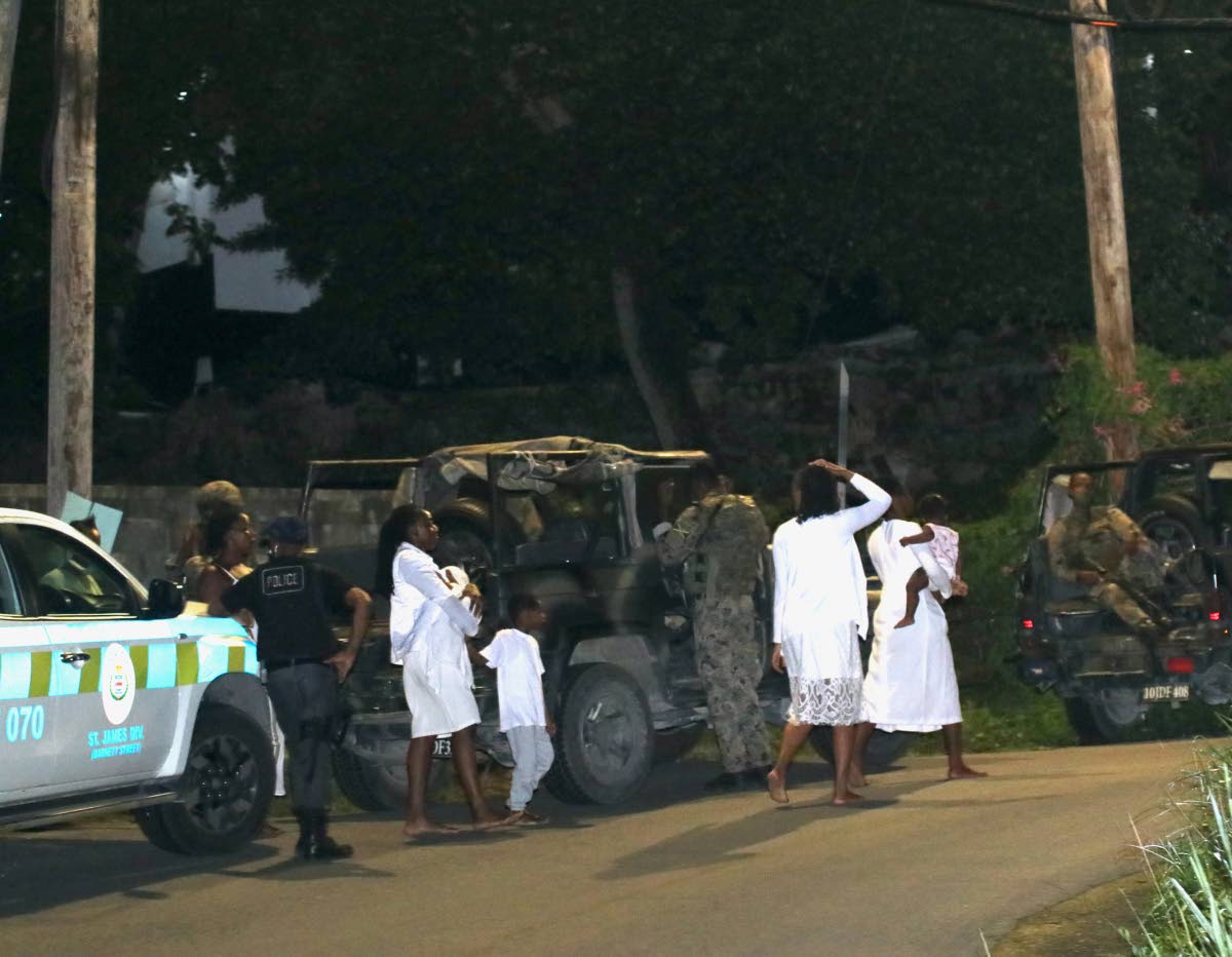 Police and soldiers bringing to end a deadly ritual at the Pathways International Kingdom Restoration Ministries in Montego Bay, St James, on October 17, 2021.