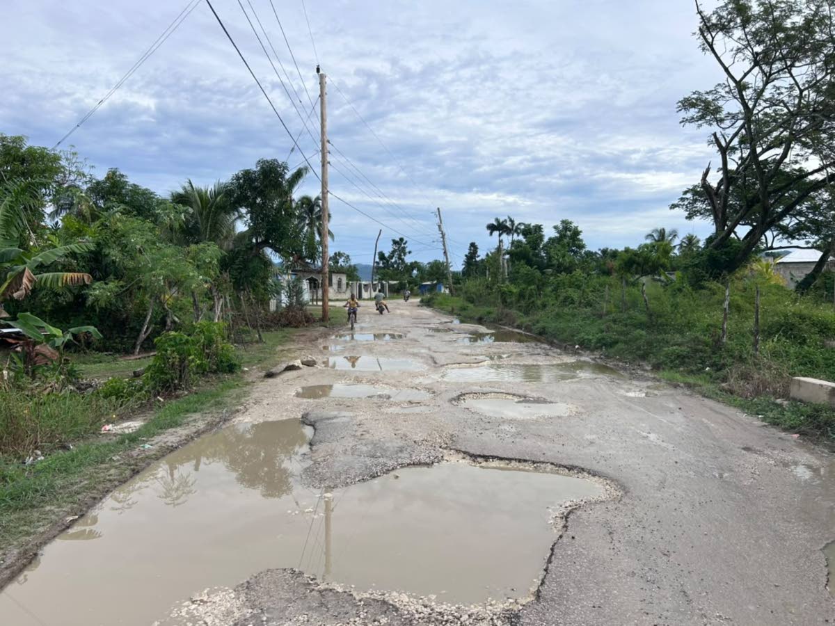 Poor road conditions in Petersfield, Westmoreland, and surrounding communities led to a protest by residents and taxi operators on Monday morning. – Mickalia Kington photo