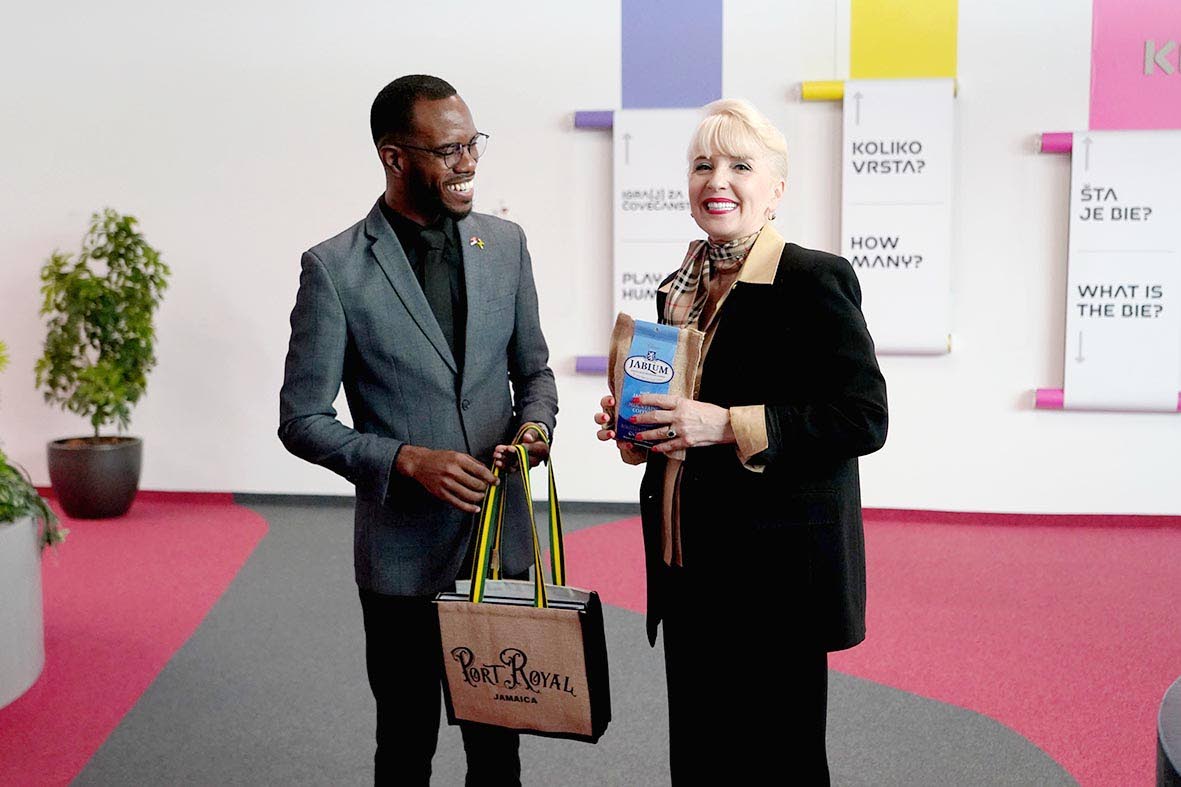 Dr Kirt Henry (left), director of the African-Caribbean Institute of Jamaica/Jamaica Memory Bank and section commissioner of the Jamaica Pavilion at Expo 2027 Belgrade, presents a gift package to Jagoda Lazarević, Serbia’s minister of internal and forei