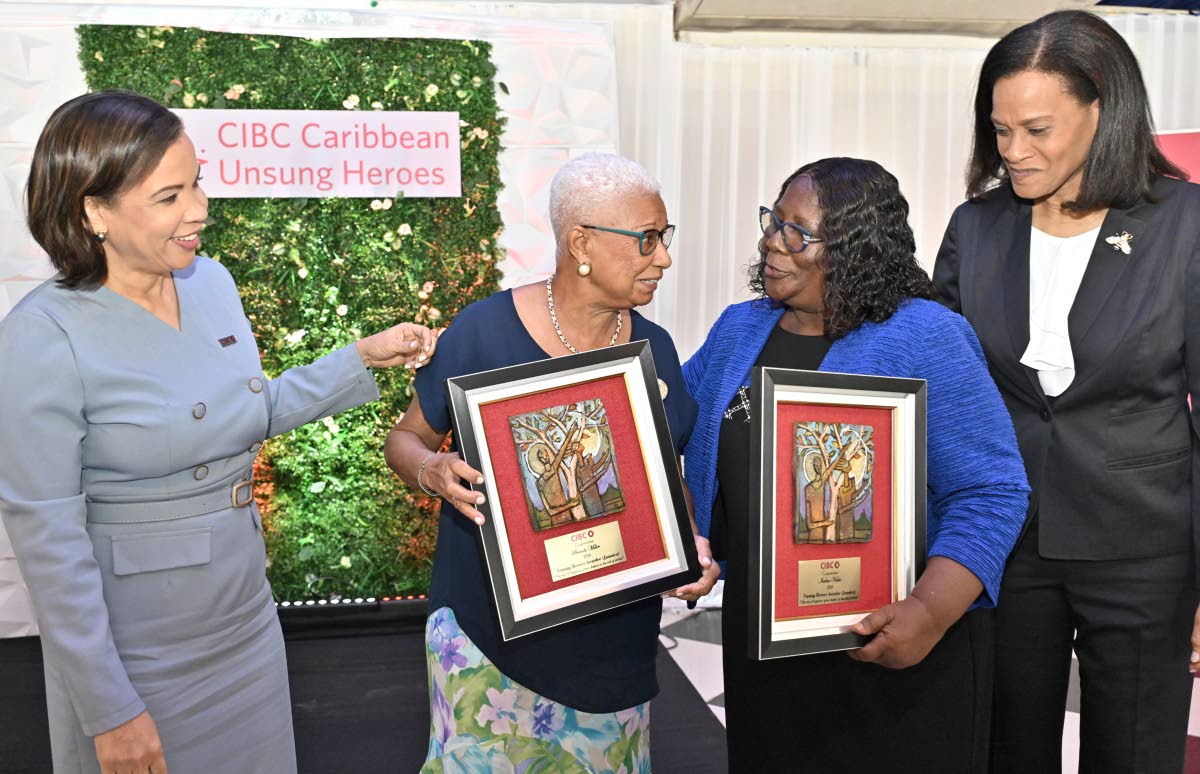 CIBC Caribbean’s Annique Dawkins (left), head of country, and Monique French (right), chief risk officer, pose with 2026 Unsung Hero winner Brenda Scarlett-Miller (second left) and runner-up Ivaline Nickie at the CIBC Caribbean 2026 Unsung Heroes Awards 