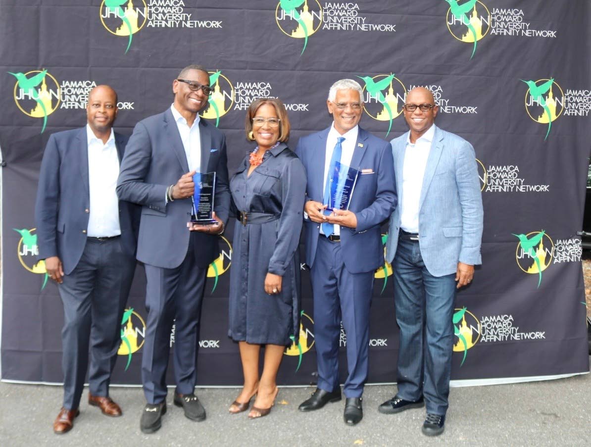  Trailblazer Award recipient Lisa Brown Alexander, owner of Wellspring Manor & Spa, shares a moment with Dr Wayne A.I. Frederick, president of Howard University; JHUAN IMPACT Awardees Trevor Heaven and Devon Bryan; and JHUAN President and Chairman Don Chri