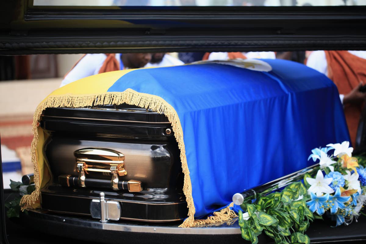 The coffin of Tooro’s King Oyo Nyimba is loaded into a hearse in the remote city of Fort Portal.