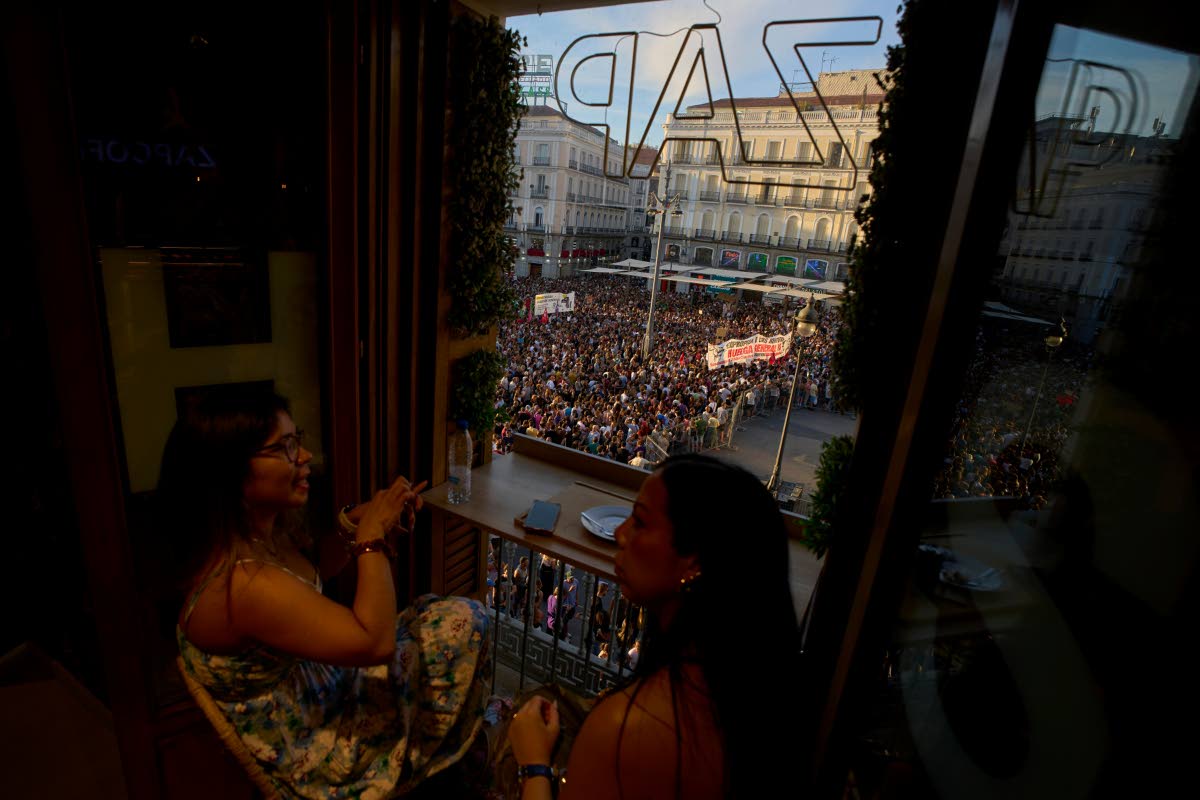 People gather during a protest following the eviction last Wednesday of 87-year-old Maricarmen to demand stronger laws to protect renters at Puerta del Sol in Madrid, Spain on Saturday.