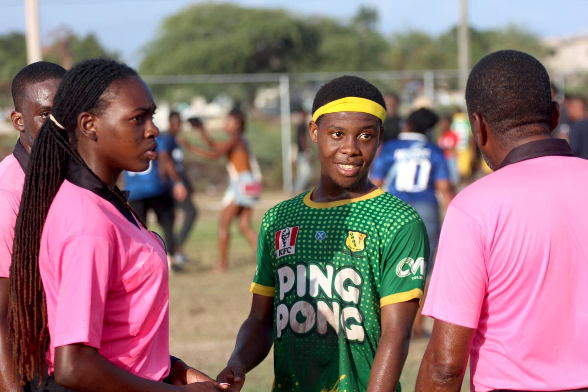 Old Harbour High’s Rayjay Smith interacting with match officials after their 2-1 victory over St Elizabeth Technical High in the Ben Francis Cup KO football match at the Linval Dixon Oval last Saturday. 