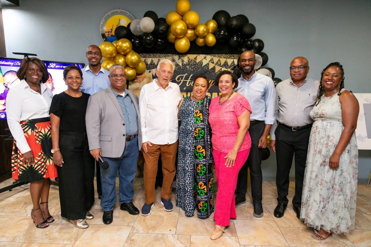  Industry colleagues: Denise Lyn Fatt shares a moment with members of the Shipping Association of Jamaica’s Managing Committee during the celebration of her 50 years in the maritime industry. 