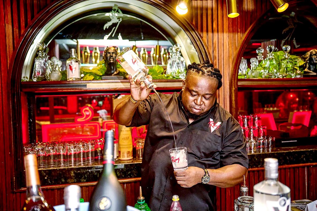 Cocktails curator Denroy Fisher shows off his skills at the launch of Rémy V.
