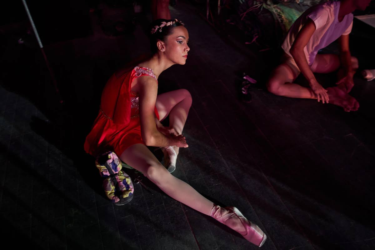 A dancer from the National Ballet of Cuba adjusts her ballet shoes before rehearsal in Havana, Cuba, August 21.