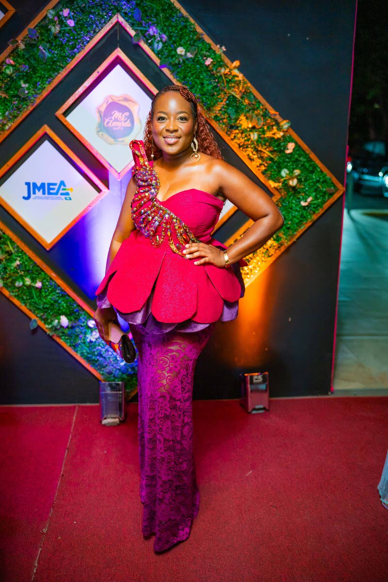 Kamesha Turner Blake, executive director at the Jamaica Manufacturers and Exporters Association, adds a sculptural flourish to her look in a Kadian Nicely design.