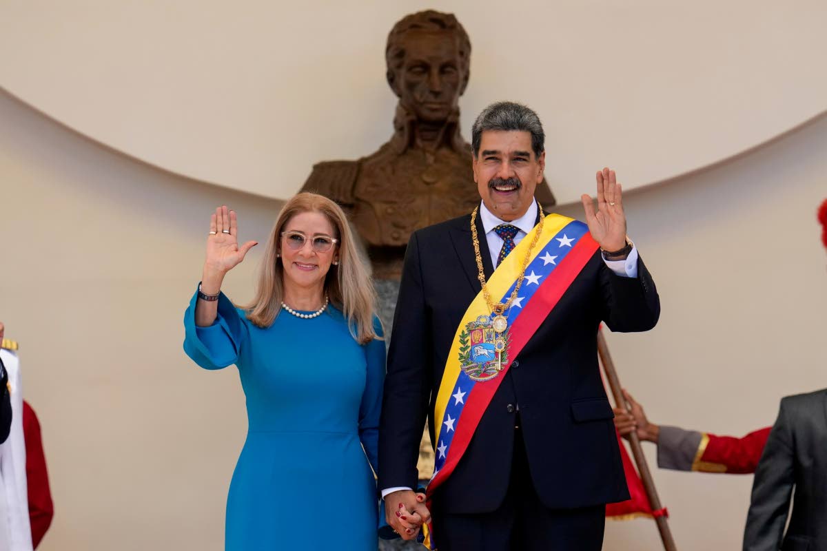 In this file photo, Venezuelan President Nicolas Maduro and his wife Cilia Flores wave after his swearing-in ceremony for a third term at the National Assembly in Caracas, Venezuela, on January 10, 2025.