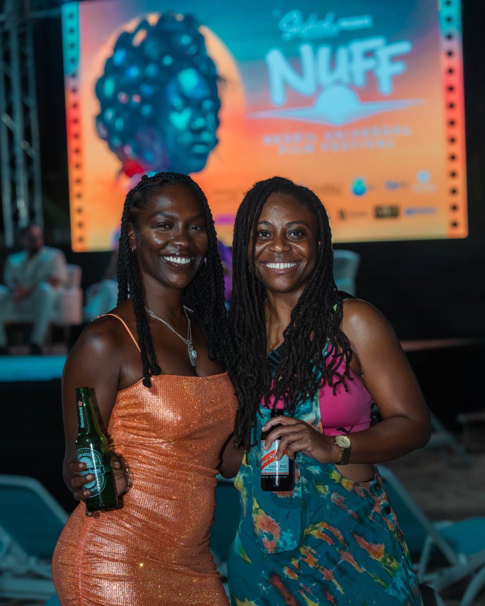 In between beer sips and taking in ‘Life and Debt’, film-maker and editor Charity Bowman (left) and New York-based entertainment lawyer Nordia Hunt greet our photog on the beachfront venue.